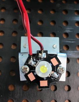 Take the new bulb and located the + symbol next to the bulb joint (see image below). 7. Solder the red wire to the silver joint next to the + symbol. 8.