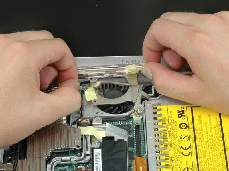 Step 23 Lift up the inverter cable with one hand, and carefully thread it around the heat sink.