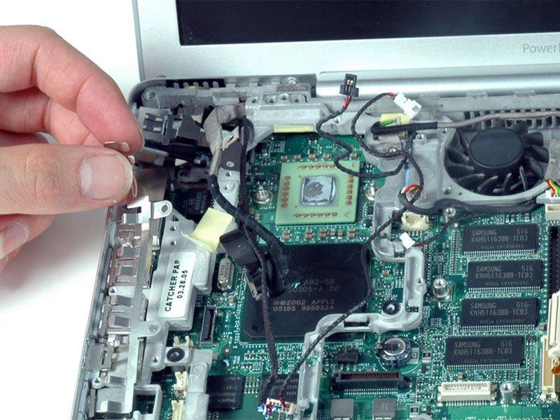 You may have to remove the metal shield above the RJ-11 board before you can lift it up.