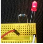 Activity 1: Turn on the Light We will complete a circuit to make an LED shine! 1. Insert a resistor across 2 rows 2.