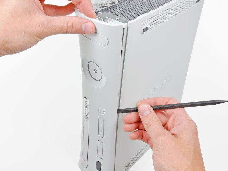 You may also accomplish this task by using the edge of the Xbox 360 opening tool, but it may scratch the plastic case.