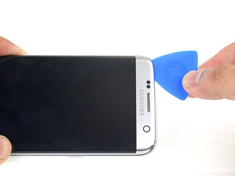 Inserting the pick too far may damage the front-facing camera or