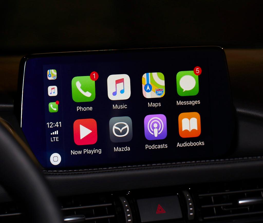 USER GUIDE Available on select models, seamlessly integrates your iphone with your vehicle s MAZDA