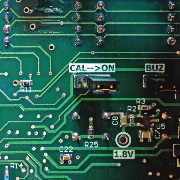 Find on the printed circuit board inside the cover 3 metal pins with the word CAL and ON next to