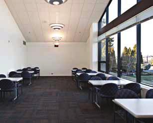Walls; 2 x2 Inlaid Acoustical Tile Ceiling and Flush Mounted Florescent Lighting, Vinyl Baseboards and Solid- Core Fire-Rated Entry Doors.