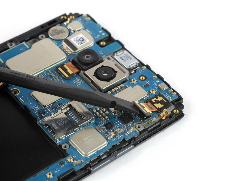 If you want to go on and remove the motherboard assembly, there is no need to remove the front facing camera after