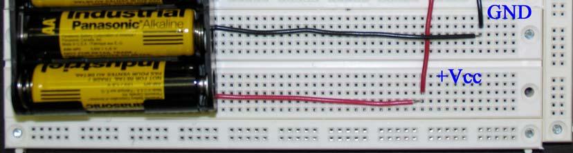 The power routed through the rightmost dip switch, which must be turned on to power the circuits. Vcc and GND are connected to all of the ICs.