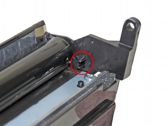 17. Remove the screw and holder