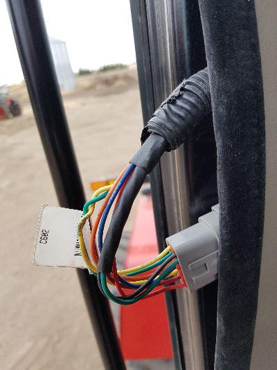 Find the connector labelled C602 behind the panel. Open it and insert the provided AgraGPS harness. Note: It is sometimes also called the display connector!