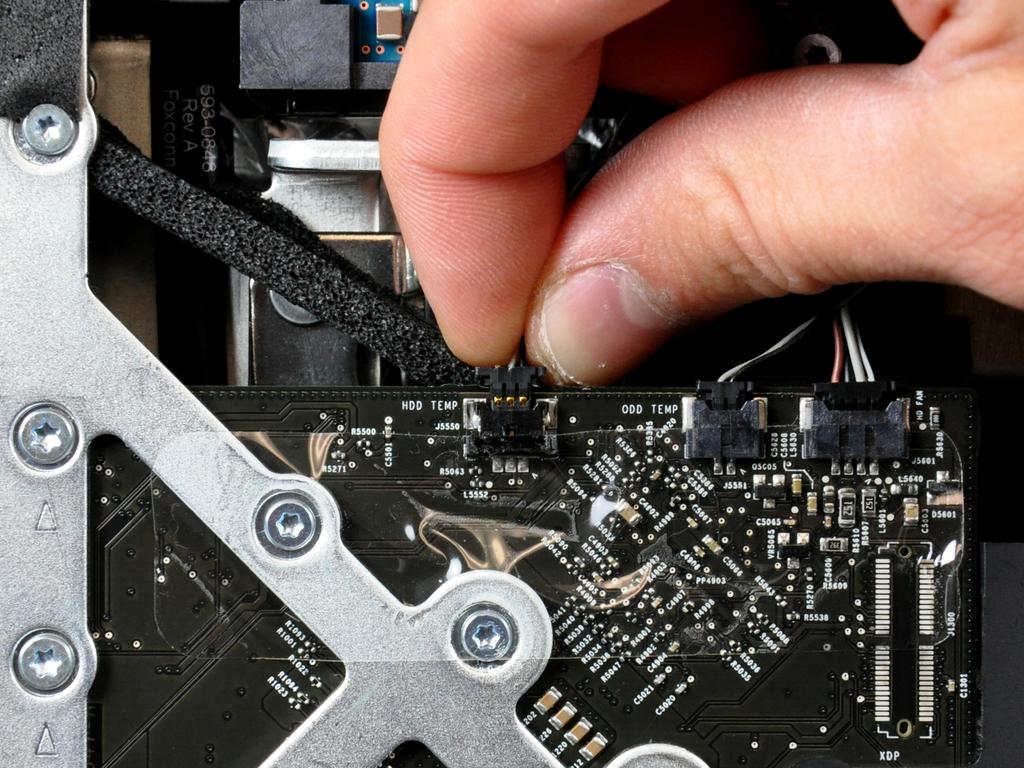 Pull the hard drive temperature sensor cable straight away from its socket on the logic board.