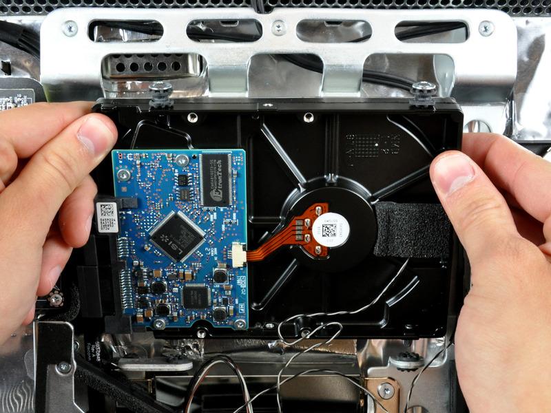 When reinstalling your hard drive, be careful not to push the rubber grommets through the openings in