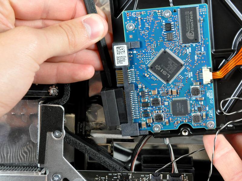 Disconnect the SATA data cable from the hard drive. Repeat this process for the SATA power cable.