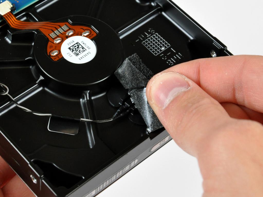 Step 18 Peel off the piece of foam tape covering the hard drive