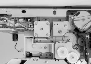9 Remove the three fuser motor screws shown in Figure 6-47.