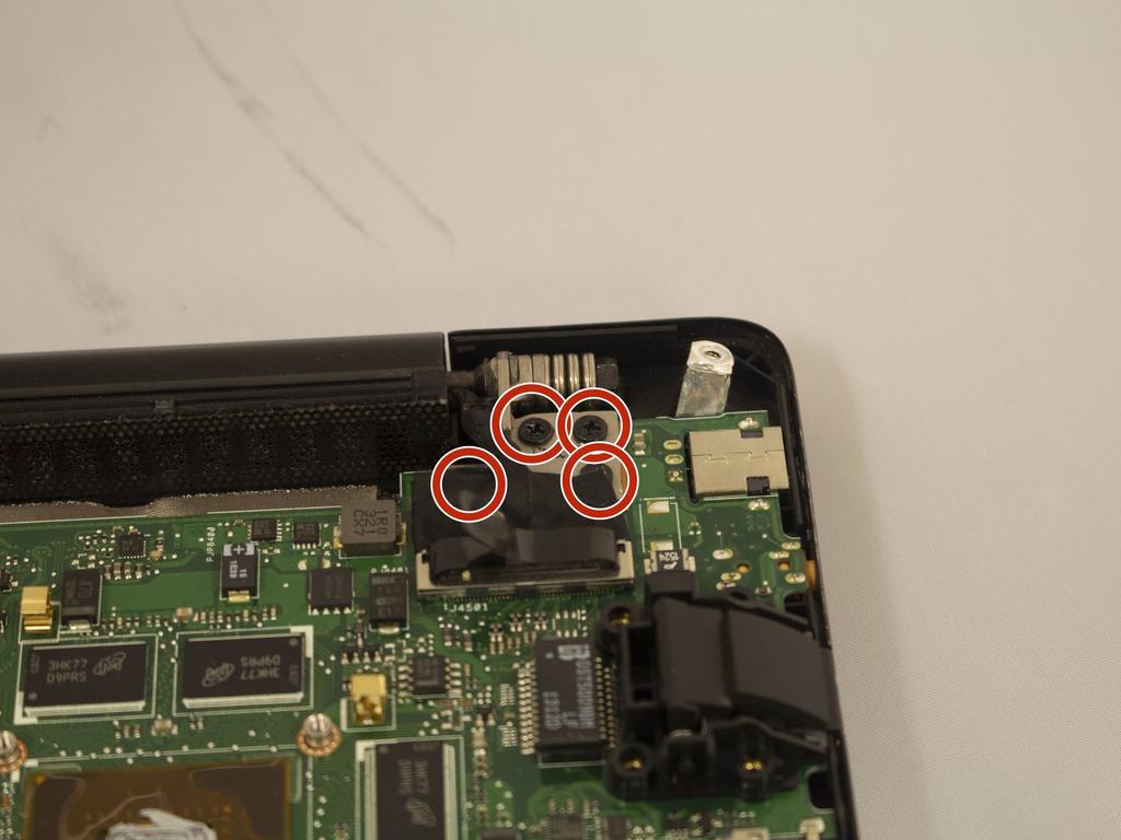 screws on the edge of the motherboard.