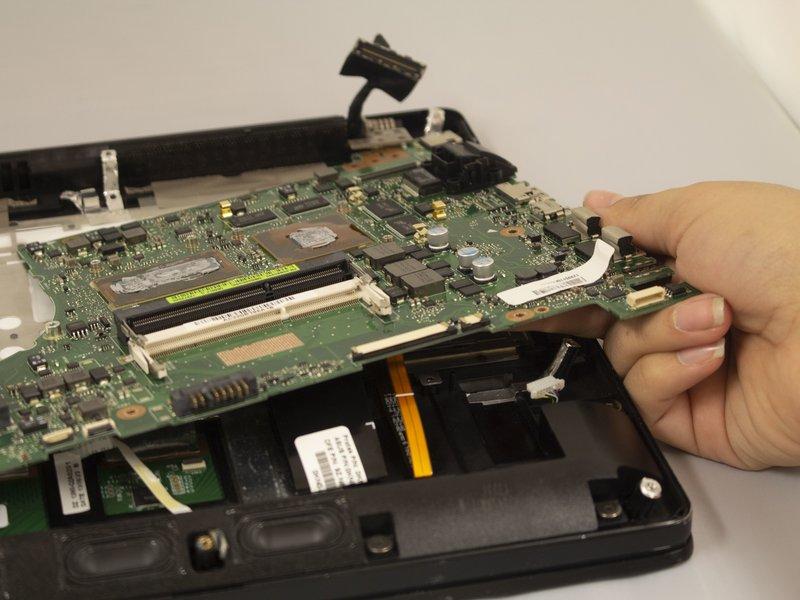 Pull the motherboard out by hand using a counterclockwise motion to remove it.