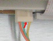 inside each slit (only three of the four have a wire inside). The terminal has a tiny metal flange at the bottom that sticks out enough to keep it from sliding out of the plug.