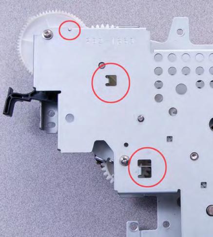 Cover it or put it in a dark place. 2. Remove the Top Cover. a. Release the toner cartridge engagement arm and remove two top and two rear screws, then unplug the control panel cable. 3.