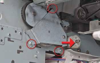Use a spring hook to detach this spring from the guide, and the guide should just fall out. 14. Remove swing plate assembly!