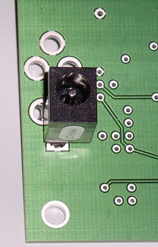 When installing the voltage regulator, make sure the component is oriented as indicated on the circuit board outline.