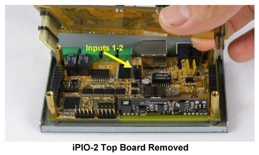 The jumpers are located on the lower PC board. Remove the top board by removing the four screws holding the top board in place and gently lifting the top board off its headers.