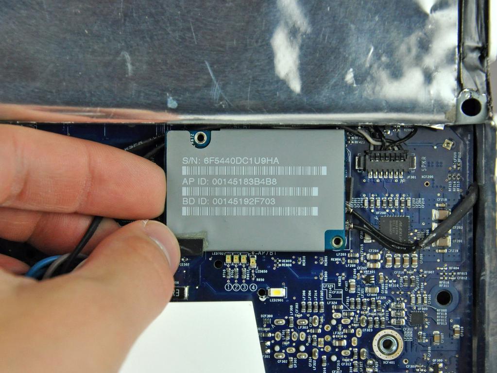 Step 15 Use your finger to lift the AirPort/Bluetooth board from its left
