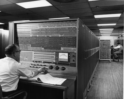 Original goal was to use new transistor technology to give 100x performance of tube-based IBM 704.