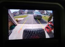 28. Below is a sample image of the rear view camera without the tire and with the tire.