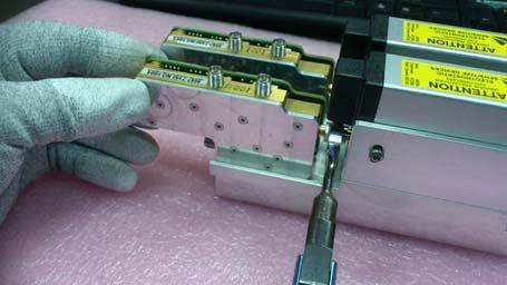 2 Remove the two screws from the back of the top RealEdge module as shown below. When replacing, torque to 5 in-lbs.