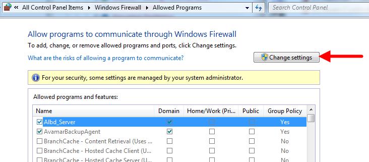 After the screen opens, click Allow a program or feature through Windows Firewall. In the next screen, click Change settings.