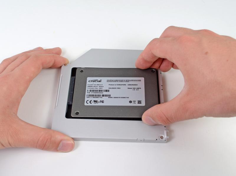 Gently place the hard drive into the enclosure's hard drive
