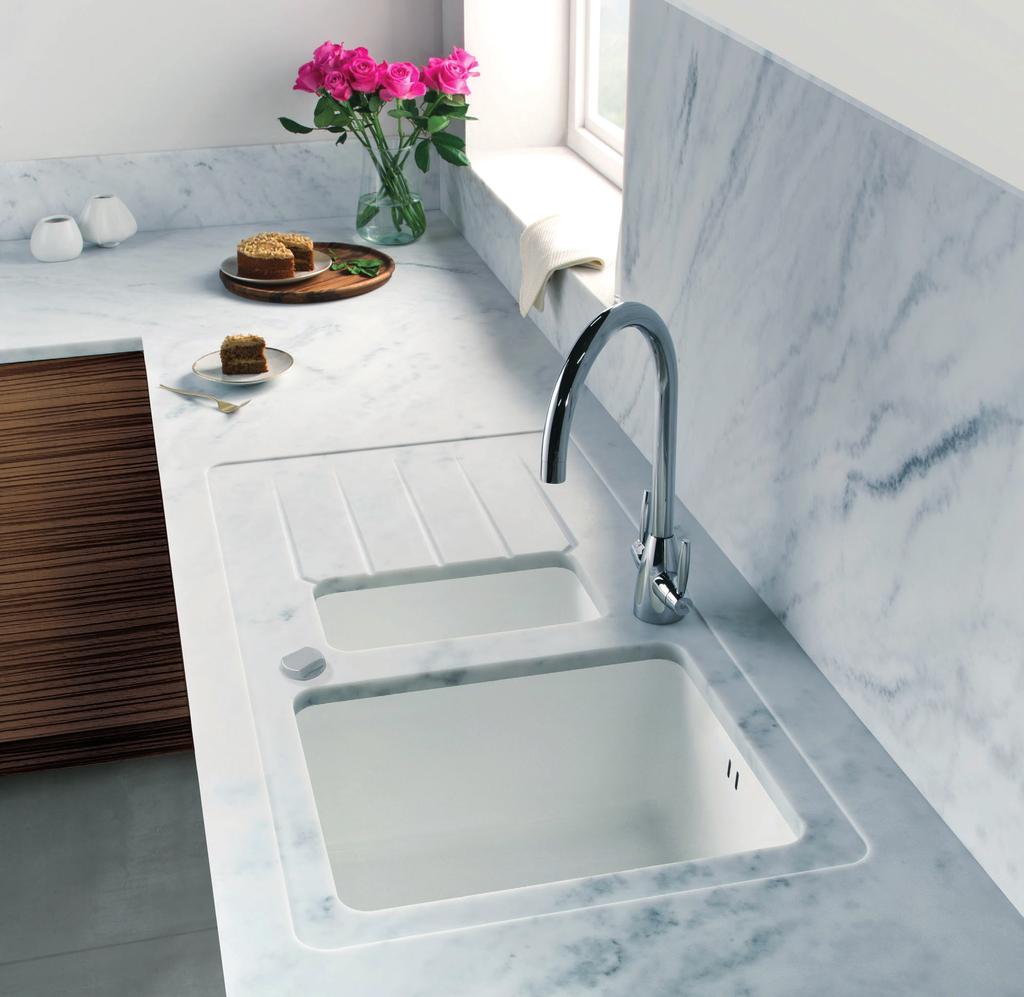 KITCHEN SINKS, TAPS & WORKTOPS DIRECTORY / SEPTEMBER 2016 Carrara white worktop with integrated white acrylic sink, co-ordinating upstand and splashback Copper fleck finish Co-ordinating worktops,