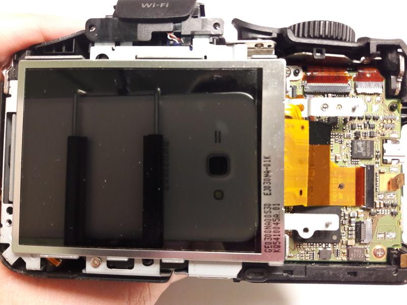 Step 13 LCD Display Locate the Display screen in the center of the camera.