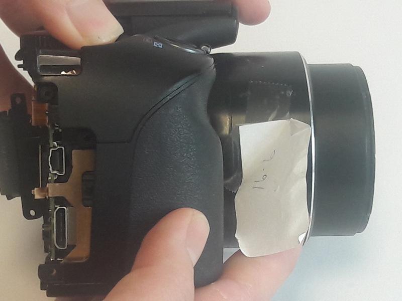 Step 9 Shutter Release Cover Hold the camera by the bottom or place