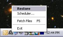 system tray (near the clock) Click on "Restore" and the