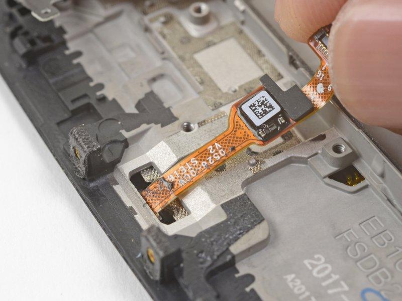 Step 28 If you are planning to reuse the fingerprint scanner, be extremely careful pulling the flex cable up. It is very delicate and prone to breaking.